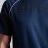 Men's oversized tee and shorts set, textured fabric, custom embroidery detail. Relaxed fit, soft drape. Likely cotton blend,