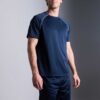 Men's oversized tee and shorts set, textured fabric, custom embroidery detail. Relaxed fit, soft drape. Likely cotton blend,