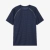 Men's oversized tee and shorts set, textured fabric, custom embroidery detail. Relaxed fit, soft drape. Likely cotton blend,