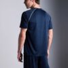 Men's oversized tee and shorts set, textured fabric, custom embroidery detail. Relaxed fit, soft drape. Likely cotton blend,