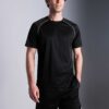 Men's oversized tee and shorts set, textured fabric, custom embroidery detail. Relaxed fit, soft drape. Likely cotton blend,