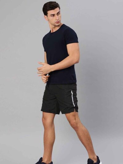 Close-up: Athletic shorts in a heathered dark gray. Notice the smooth, performance fabric and reinforced stitching. Hidden zi