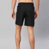 Close-up: Athletic shorts in a heathered dark gray. Notice the smooth, performance fabric and reinforced stitching. Hidden zi