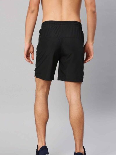 Close-up: Athletic shorts in a heathered dark gray. Notice the smooth, performance fabric and reinforced stitching. Hidden zi