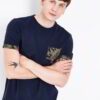 Close-up of a custom-printed t-shirt. Fine, tight knit fabric. Vibrant, detailed graphic. Strong, even stitching. Rich, dark
