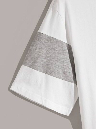 Close-up of a men's t-shirt showing the printed design. Fine knit fabric, clean stitching detail. Appears soft and breathable