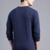 Close-up of a navy blue t-shirt with a white logo print. Cotton fabric texture, clean stitching detail. Short sleeve crew nec