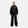 Women's tracksuit set. Close-up shows soft, brushed fleece texture. Heather grey top & matching bottoms, detailed stitching.