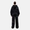 Women's tracksuit set. Close-up shows soft, brushed fleece texture. Heather grey top & matching bottoms, detailed stitching.