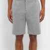 Lightweight surf shorts in a teal and navy pattern. Note the fine stitching and fast-drying woven fabric. Perfect beachwear!