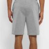 Lightweight surf shorts in a teal and navy pattern. Note the fine stitching and fast-drying woven fabric. Perfect beachwear!