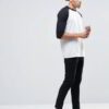 Soft, retail-ready t-shirts wholesale. Close-up shows smooth fabric, quality stitching. Customizable tee, light heather grey,