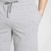 Men's stretch cotton lounge set. T-shirt and shorts. Soft texture, fine stitching. Relaxed fit, breathable fabric. Light grey