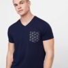 Close-up of a custom-printed tee. Smooth, dense cotton, neat stitching. Royal blue hue, ribbed crew neck, and crisp graphic.