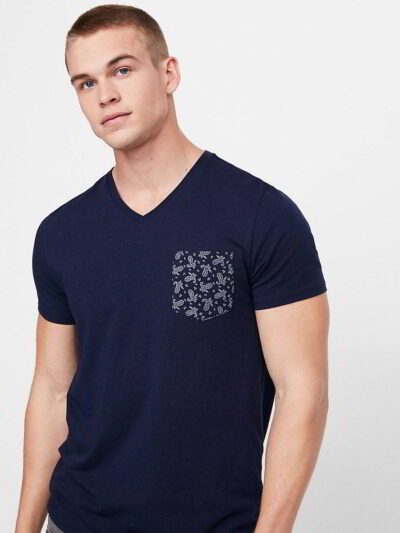 Close-up of a custom-printed tee. Smooth, dense cotton, neat stitching. Royal blue hue, ribbed crew neck, and crisp graphic.