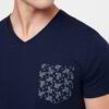 Close-up of a custom-printed tee. Smooth, dense cotton, neat stitching. Royal blue hue, ribbed crew neck, and crisp graphic.