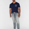 Close-up of a custom-printed tee. Smooth, dense cotton, neat stitching. Royal blue hue, ribbed crew neck, and crisp graphic.
