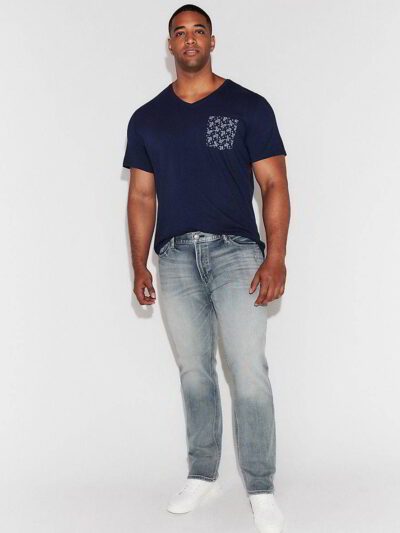 Close-up of a custom-printed tee. Smooth, dense cotton, neat stitching. Royal blue hue, ribbed crew neck, and crisp graphic.
