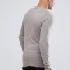 Close-up of a soft, heather grey t-shirt. Notice the fine stitching and comfortable feel. Perfect blank canvas for custom des