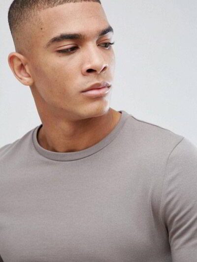Close-up of a soft, heather grey t-shirt. Notice the fine stitching and comfortable feel. Perfect blank canvas for custom des