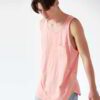 Close-up of breathable athletic tank tops in vibrant team colors with reinforced stitching. Soft, lightweight, moisture-wicki