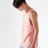 Close-up of breathable athletic tank tops in vibrant team colors with reinforced stitching. Soft, lightweight, moisture-wicki