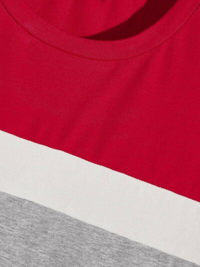 Close-up of a custom text t-shirt. Notice smooth fabric, reinforced stitching. Short sleeve, solid color. Ready for your desi