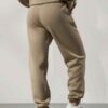 Women's tracksuit set. Close-up on soft fabric texture, visible stitching. Versatile for all seasons, comfortable fit. Sporty