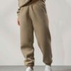 Women's tracksuit set. Close-up on soft fabric texture, visible stitching. Versatile for all seasons, comfortable fit. Sporty