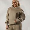 Women's tracksuit set. Close-up on soft fabric texture, visible stitching. Versatile for all seasons, comfortable fit. Sporty