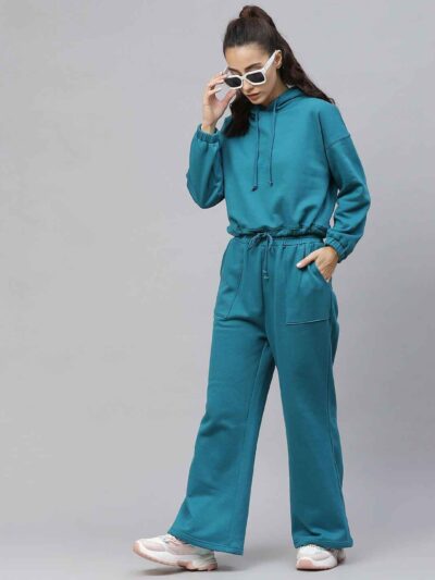 Women's tracksuit set: close-up showing soft, heather gray fabric, elastic waistband joggers, and neat stitching. Athleisure