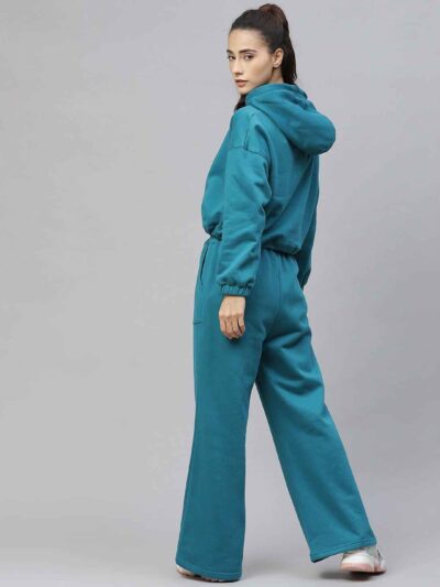 Women's tracksuit set: close-up showing soft, heather gray fabric, elastic waistband joggers, and neat stitching. Athleisure