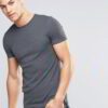 Close-up of vibrant customized t-shirts showing smooth, soft fabric texture and precise stitching. Solid colors hint at easy