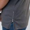 Close-up of vibrant customized t-shirts showing smooth, soft fabric texture and precise stitching. Solid colors hint at easy