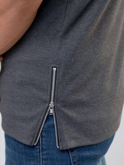 Close-up of vibrant customized t-shirts showing smooth, soft fabric texture and precise stitching. Solid colors hint at easy