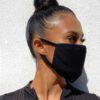 Soft, reusable face mask in a cheerful floral print. Close-up shows fine cotton weave and durable stitching. Washable and com