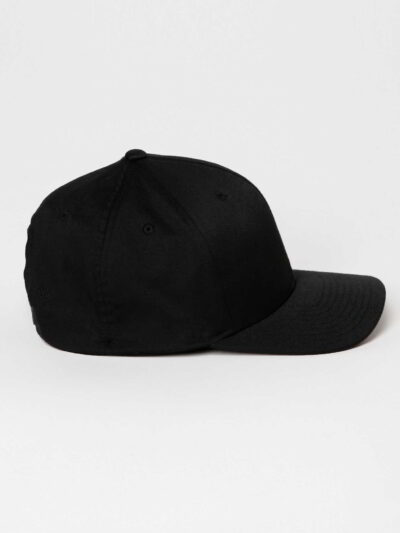 Close-up of soft, organic cotton cap; visible stitching, textured fabric. Comfortable headwear, muted earthy tones. Ethical f