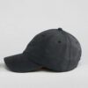 Navy polo cap with detailed embroidered golf scene. Notice the textured pique knit fabric and vibrant stitching of the design