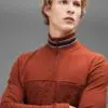 Zippered polo shirt. Soft-touch cotton fabric, stand-up collar, subtle texture. Fine stitching detail visible on a custom gar