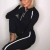 Sportswear tracksuits: close-knit fabric, contrast piping. Zippered jacket, tailored fit pants. Durable training gear with de