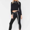 Sportswear tracksuits: close-knit fabric, contrast piping. Zippered jacket, tailored fit pants. Durable training gear with de
