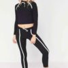 Sportswear tracksuits: close-knit fabric, contrast piping. Zippered jacket, tailored fit pants. Durable training gear with de
