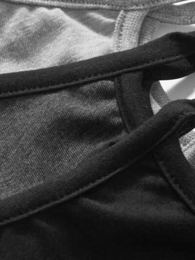 Close-up of a vibrant, custom-printed fabric face mask. Notice the soft texture, neat stitching & comfortable ear loops. Mult