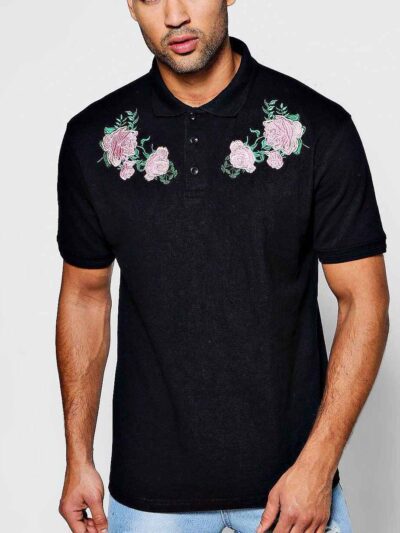 Polo shirts with delicate floral embroidery, soft textured fabric, and subtle stitching. High-quality cotton blend. Perfect f