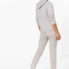 Heather gray gym tracksuit. Close-up shows textured, breathable fabric and reinforced stitching. Athletic cut for optimal mov