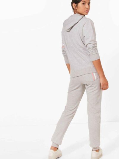 Heather gray gym tracksuit. Close-up shows textured, breathable fabric and reinforced stitching. Athletic cut for optimal mov