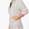 Heather gray gym tracksuit. Close-up shows textured, breathable fabric and reinforced stitching. Athletic cut for optimal mov