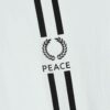 Striped ringer tee featuring custom letter graphic. Soft knit texture, durable stitched seams. Contrasting collar & cuffs add