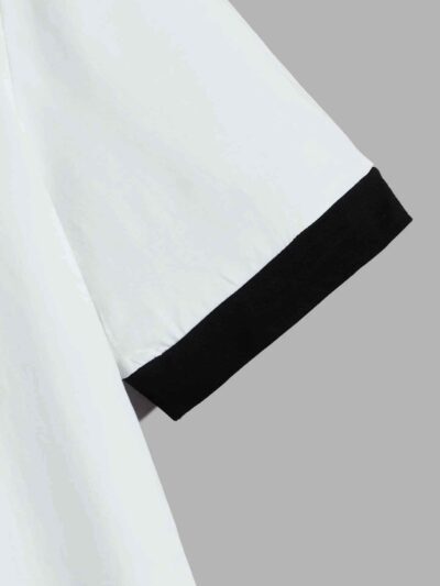Striped ringer tee featuring custom letter graphic. Soft knit texture, durable stitched seams. Contrasting collar & cuffs add