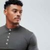 Close-up of navy golf polo shirt showing fine pique knit texture, crisp collar stitching, and subtle tailored fit. Ideal for